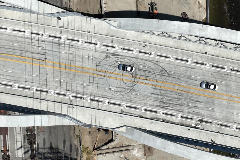 The 6th Street Viaduct is marked up from a street takeover event. 