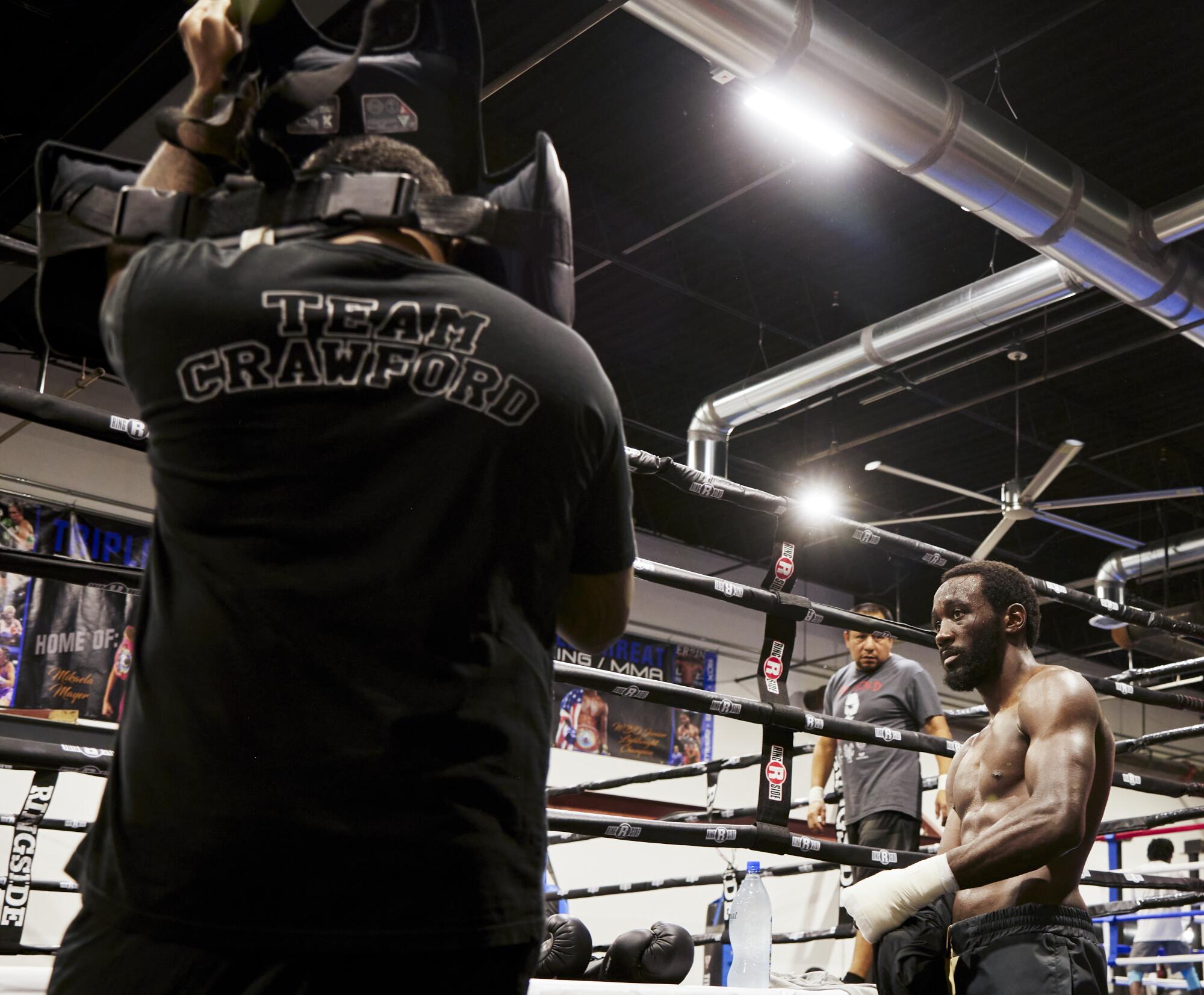 Terence "Bud" Crawford takes a moment to cool down and recover between exercises at the renowned Triple Threat Boxing Gym