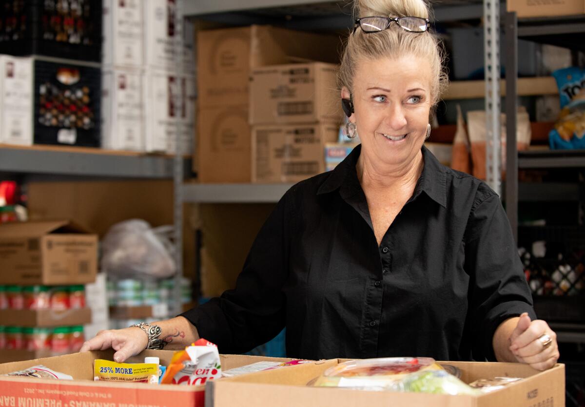 Recovery Road founder Robin Rush stands at the nonprofit's warehouse.