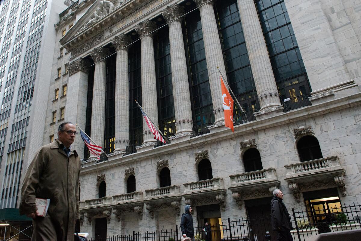 A man walks past the New York Stock exchange on Feb. 24.