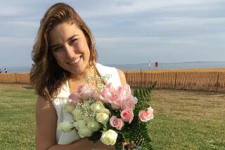 Ksenia Karelina poses in a wedding photo.