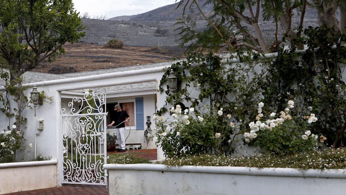 Don Fauntleroy's neighborhood in the Trancas Canyon area of Malibu is at risk for mudslides during winter rains. The surrounding hillsides were burned by the Woolsey fire.