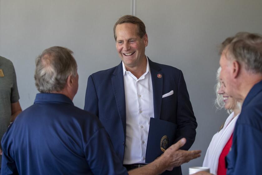 HUNTINGTON BEACH, CALIF. -- THURSDAY, AUGUST 15, 2019: U.S. Congressman Harley Rouda, representing the 48th District of California, center, talks to members of the Huntington Beach Rotary Club at the Meadowlark Golf Course in Huntington Beach. Rouda is a vulnerable Orange County freshmen who has come out in favor of impeachment proceedings. Rep. Harley Rouda spends the day criss-cross his district and make his case for re-election in tough swing district. Photo taken Thursday, Aug. 15, 2019. (Allen J. Schaben / Los Angeles Times)