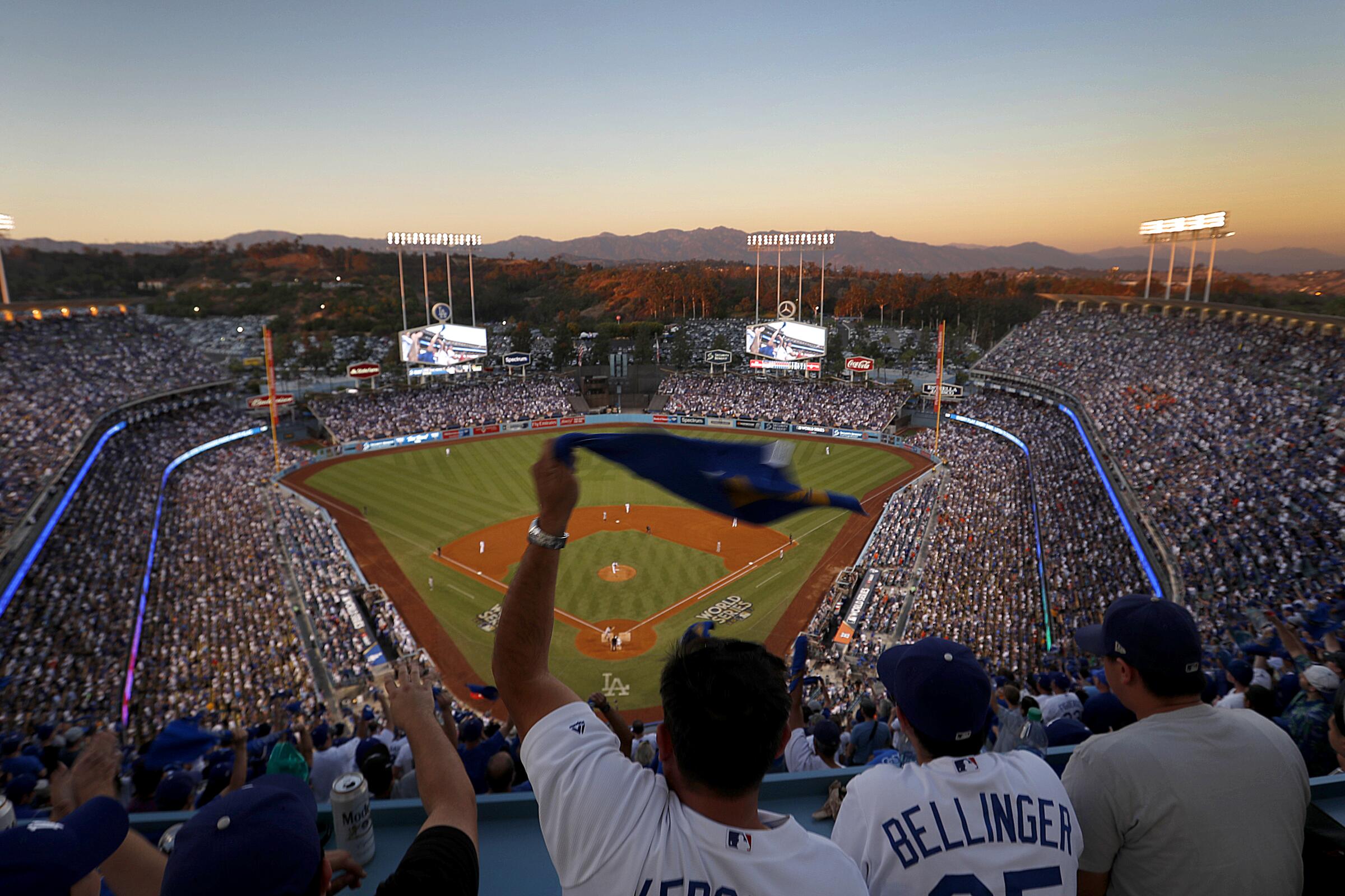 Dodgers fans wave souvenir towels during the 2017 World Series.