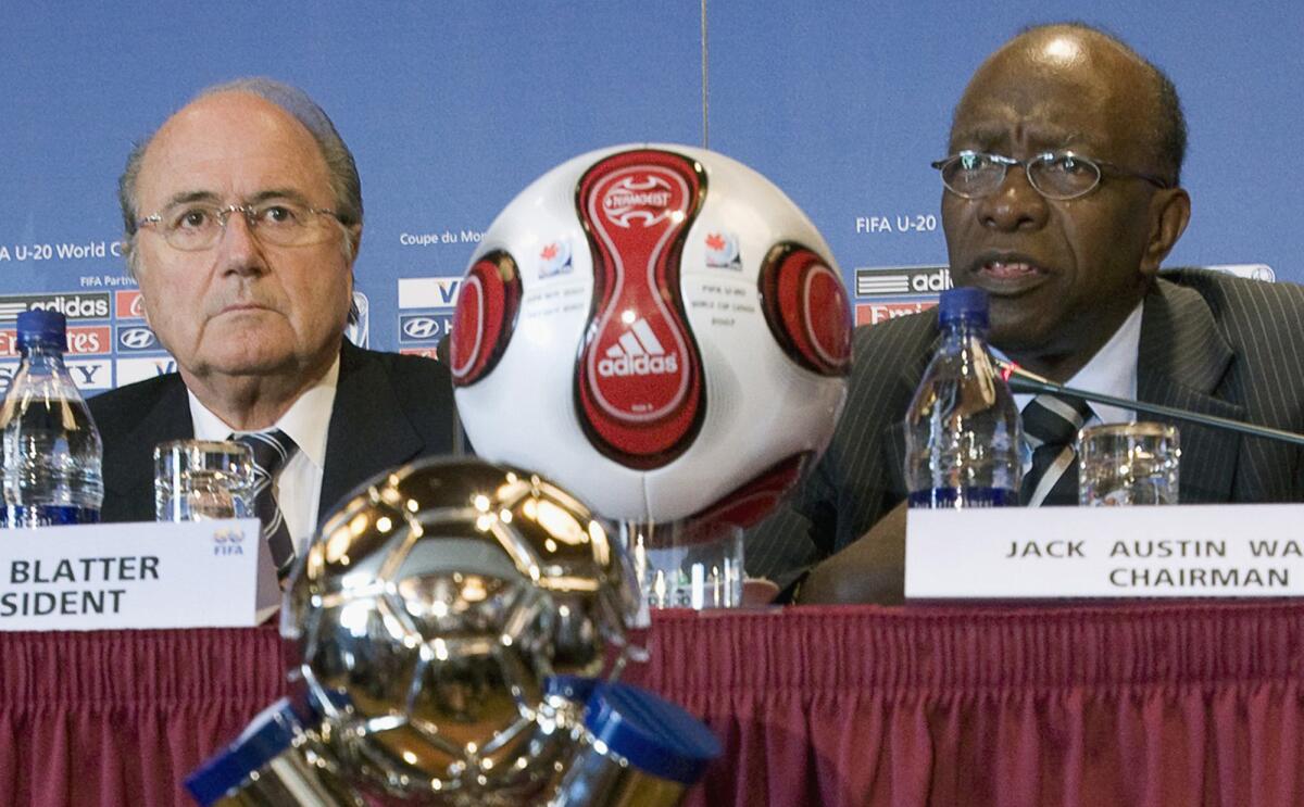 Sepp Blatter, left, and Jack Warner attend a news conference in Toronto on July 20, 2007.