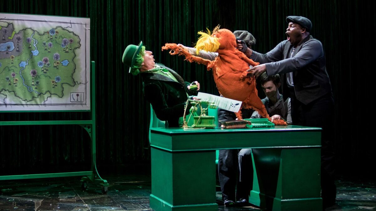 From left: Steven Epp as the Once-ler, and Meghan Kreidler, Rick Miller and H. Adam Harris (with puppet) as the Lorax, in "Dr. Seuss's The Lorax,"