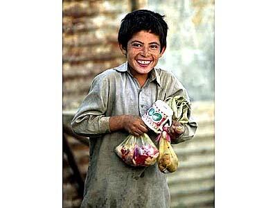 13-yr-old Naeem carries dinner for his family of 8.