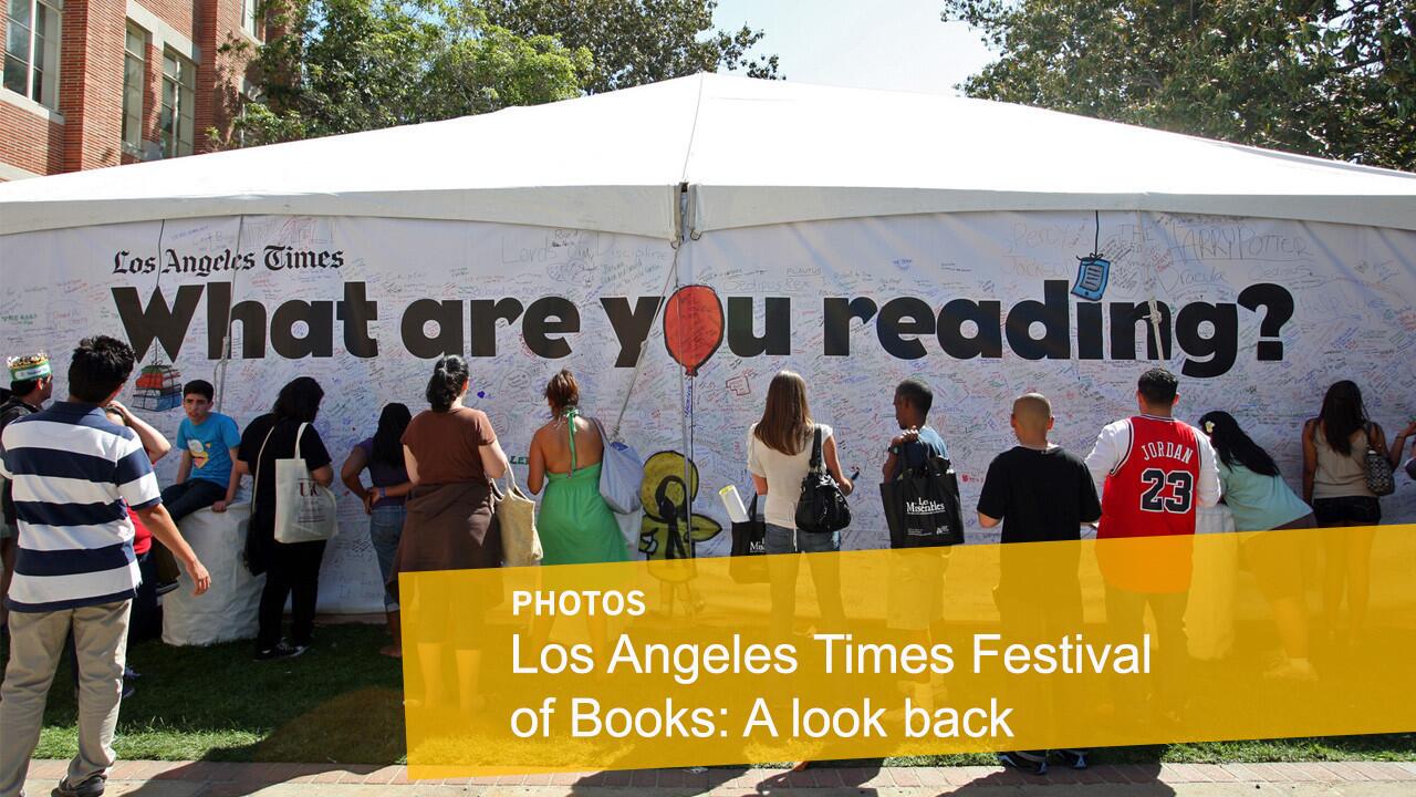 People share their current reads on a graffiti wall at the Los Angeles Times Festival of Books at USC in 2011. Madeline, from the children's books, looks on. READ MORE: Full coverage of the Festival of Books