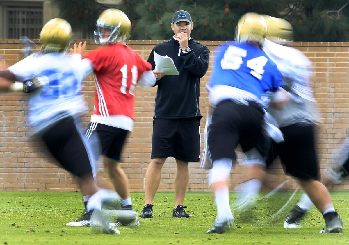 UCLA Coach Jim Mora likes to see his players put pressure on one another during team practices.