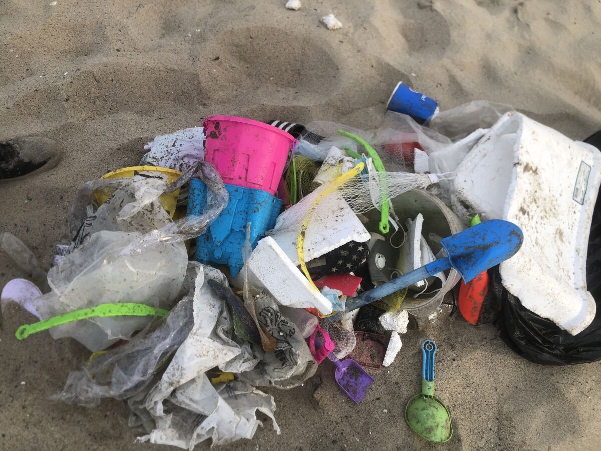 A pile of trash on the sand