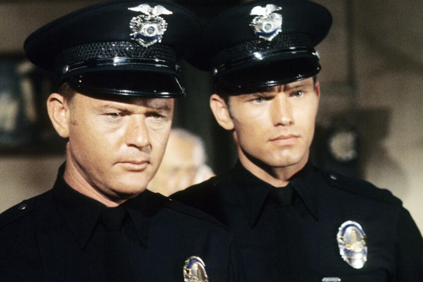 Martin Milner, left, as Officer Pete Malloy and Kent McCord as Officer Jim Reed in "Adam-12."