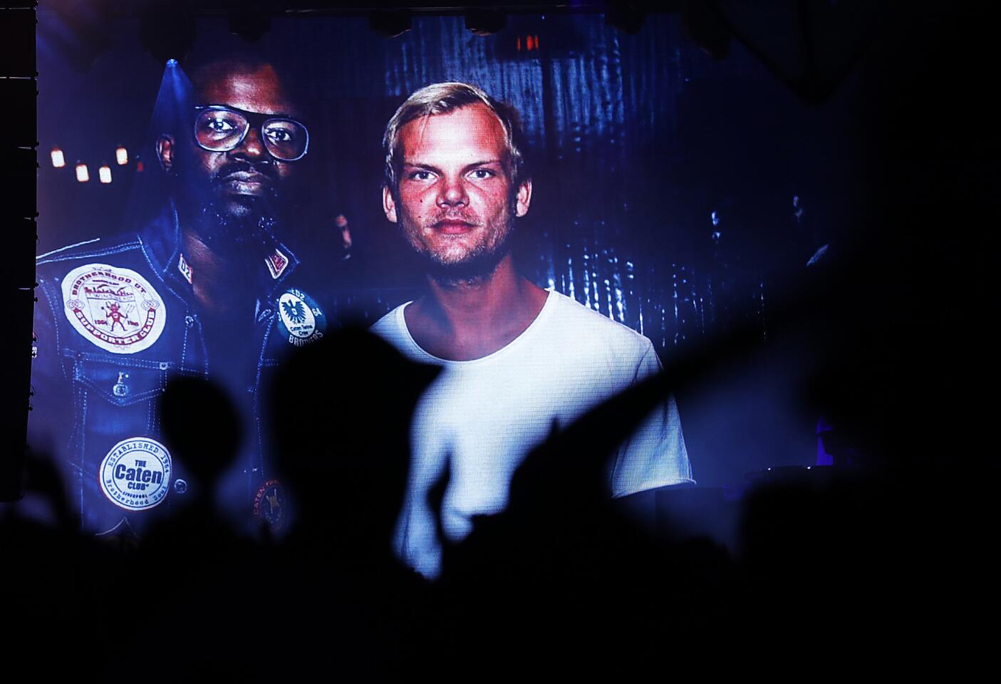 DJ Black Coffee, left, pays tribute to Swedish DJ Avicii, who was found dead Friday.