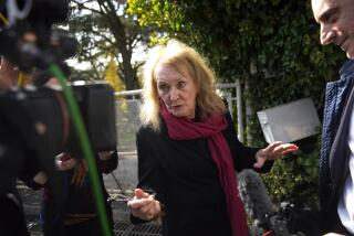 French author Annie Ernaux adresses to media outside her home in Cergy-Pontoise, outside Paris, Thursday, Oct. 6, 2022.