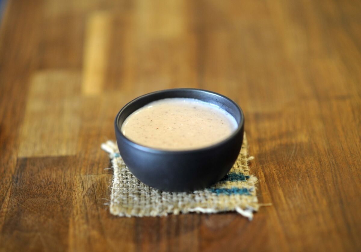Atole, a masa milk and burnt strawberries drink