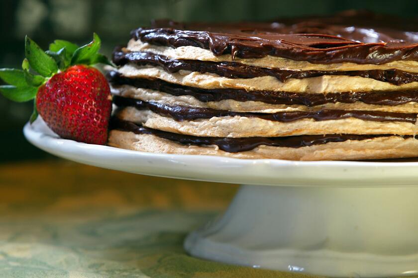 This recipe for meringue layer cake features layers of cloud-like meringue and sweet chocolate.