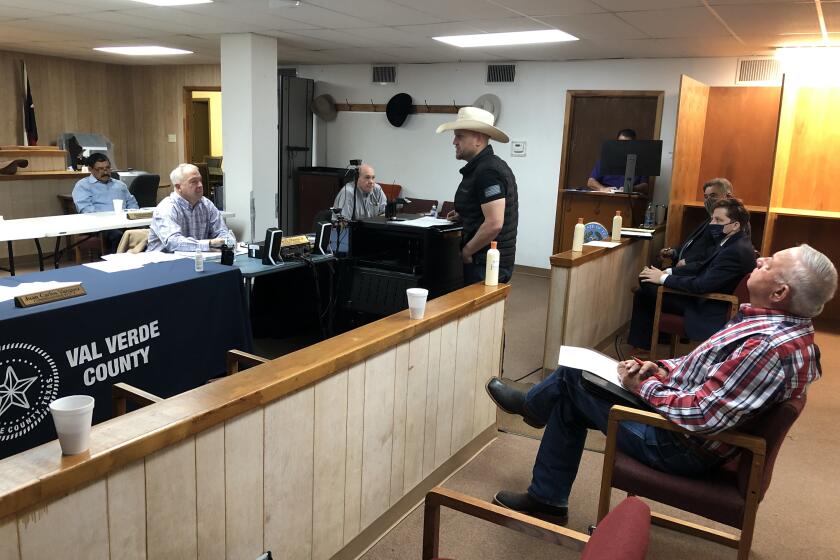 Samuel Hall, founder of Patriots for America, addresses county commissioners in Texas