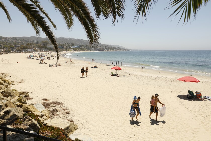 The city of Laguna Beach has posted signs that read "You must wear a face covering. It's the law"