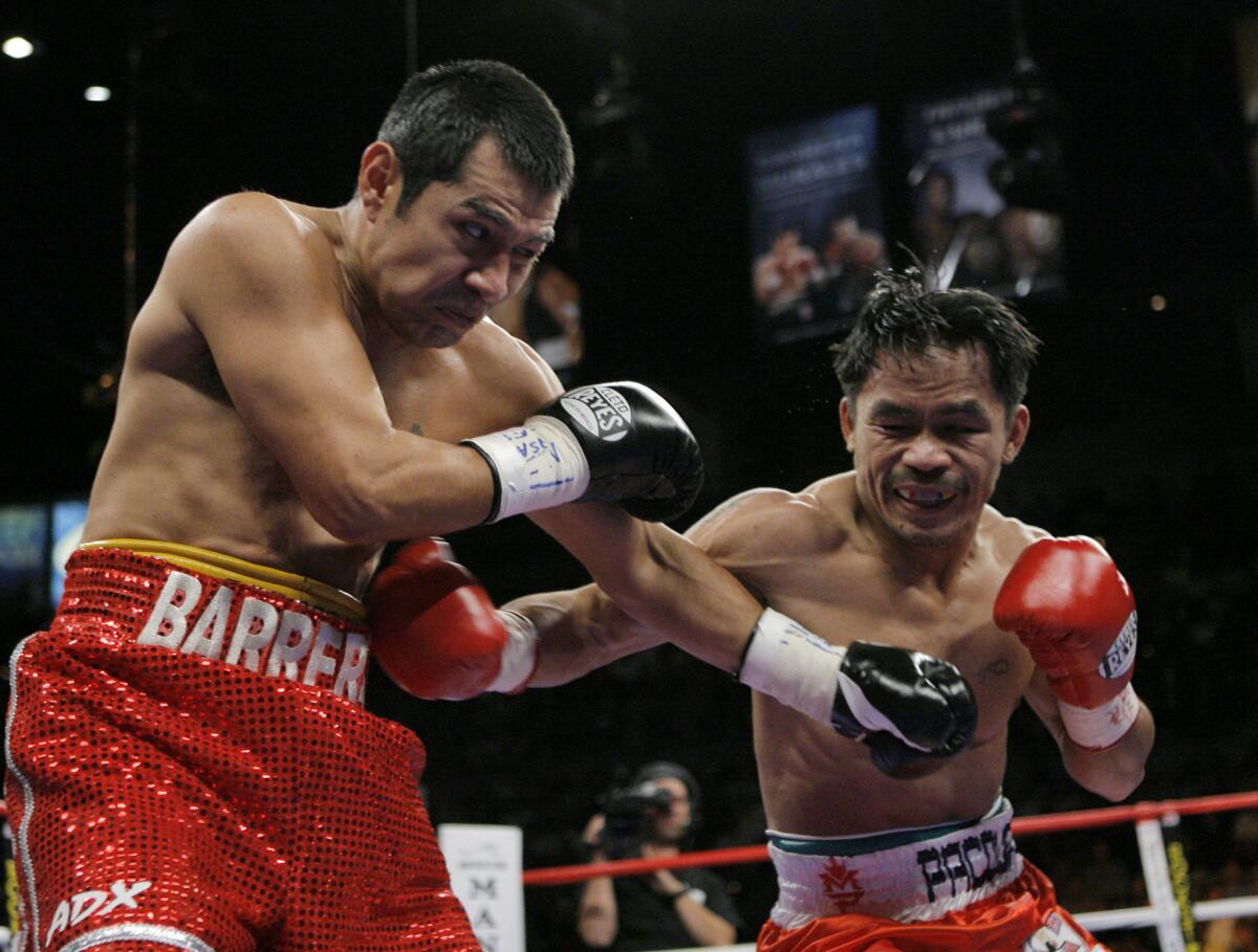 Manny Pacquiao, right, and Marco Antonio Barrera trade punches in 2007.