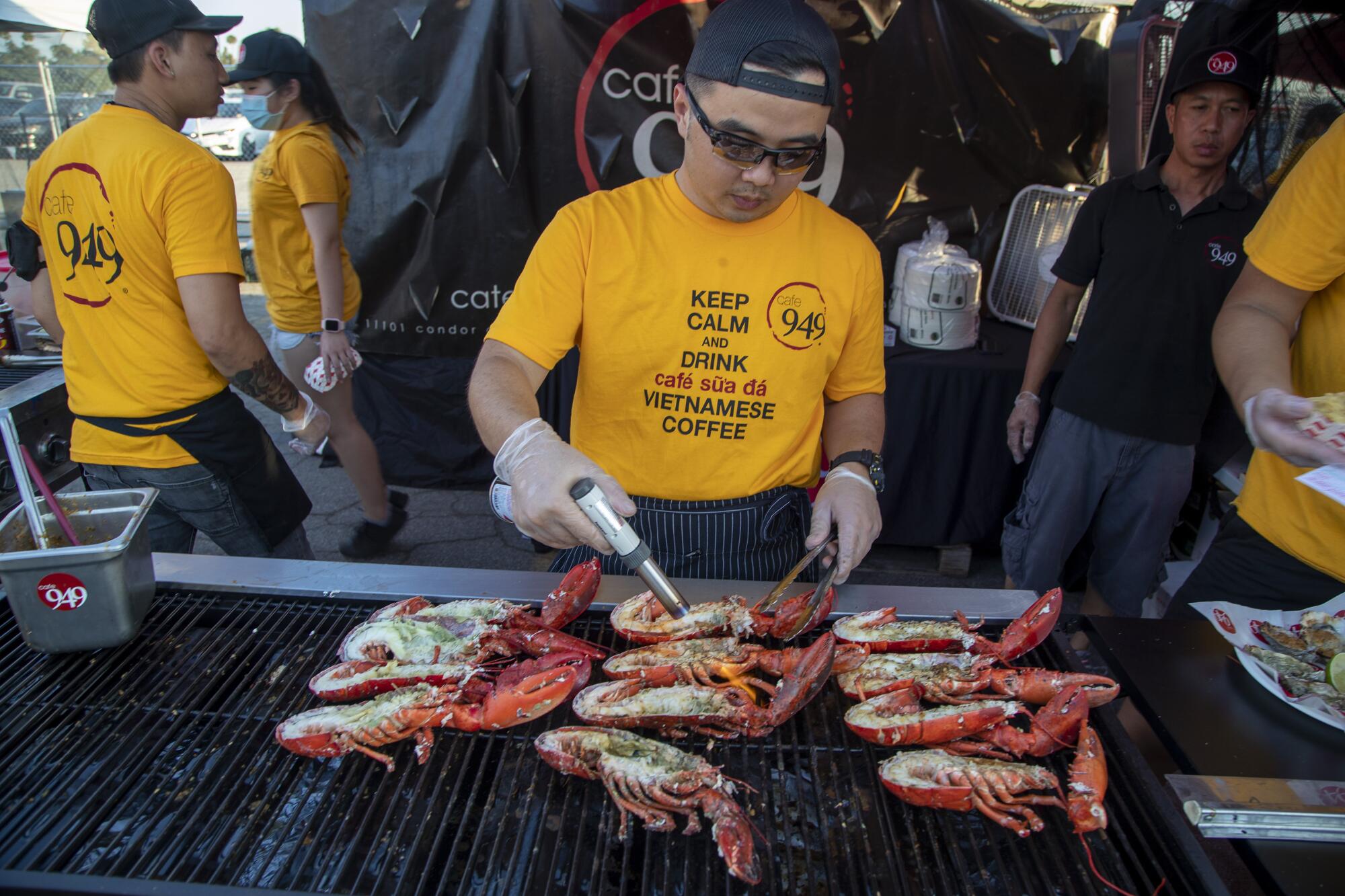 Cafe 949 chef Tan Vo prepares lobsters at the 626 Night Market at Santa Anita Park in Arcadia.