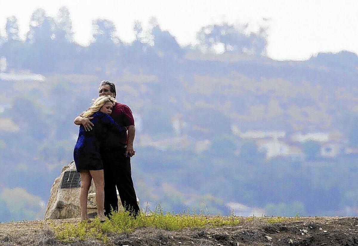 Family members console each other as the search continued for Joseph Sanchez, 18, who disappeared after jumping from a ledge into the ocean at Inspiration Point in Rancho Palos Verdes.