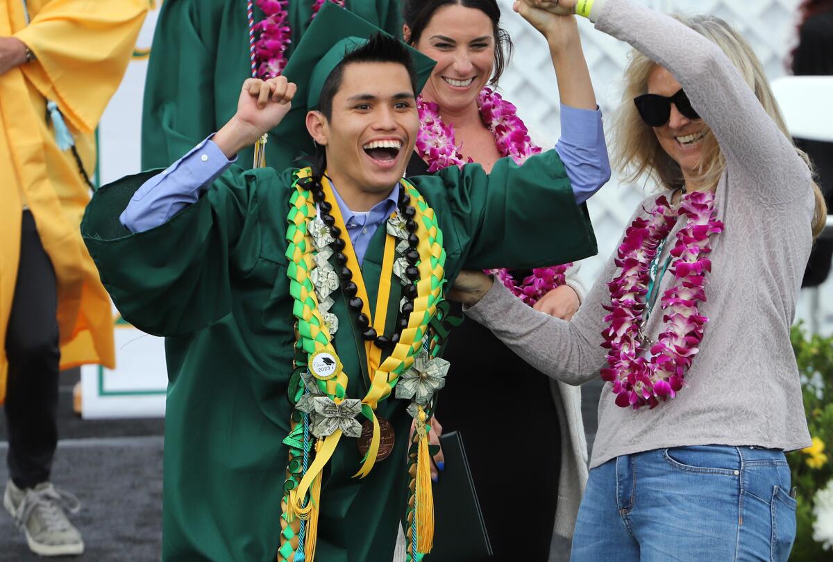 Edison High School graduate Cael Studebaker celebrates after receiving his diploma during Wednesday's ceremony.