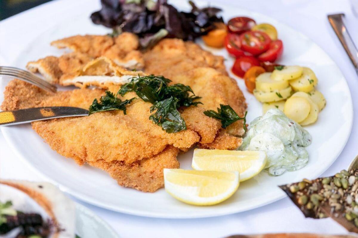 Spago's Wiener schnitzel with marinated cucumbers and fingerling potato salad.