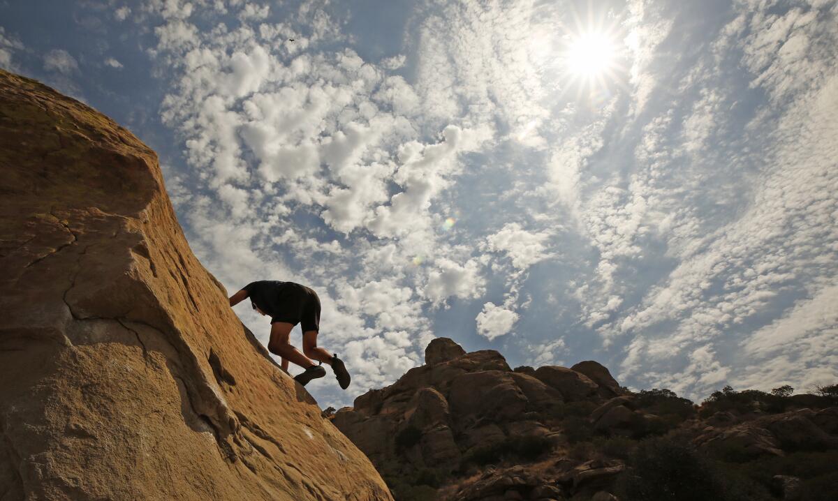 Josh Puchalski practices his bouldering skills at Stoney Point Park.