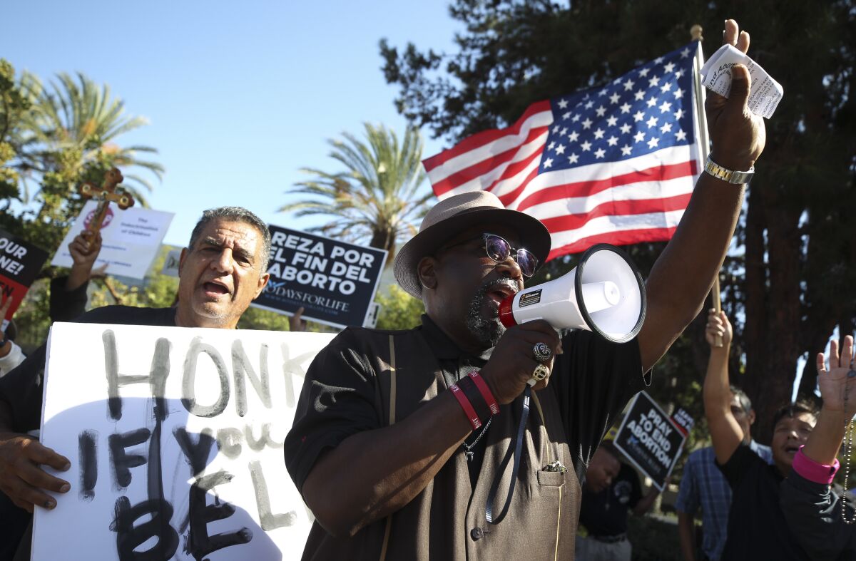 Dennis Hodges in 2019 used a bullhorn at a protest against Drag Queen Story Hour at the Chula Vista Public Library.