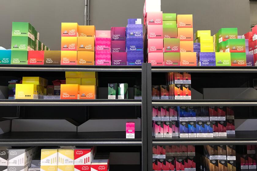 Flavored vaping products containing nicotine are seen in a store in Los Angeles, California, September 17, 2019. - New York became the second US state to ban flavored e-cigarettes Tuesday, following several deaths linked to vaping that have raised fears about a product long promoted as less harmful than smoking. (Photo by Robyn Beck / AFP) (Photo credit should read ROBYN BECK/AFP/Getty Images)