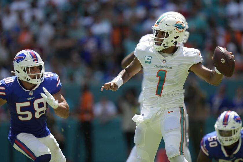 Buffalo Bills linebacker Matt Milano (58) rushes towards Miami Dolphins quarterback Tua Tagovailoa (1) before he was injured on a play during the first half of an NFL football game, Sunday, Sept. 25, 2022, in Miami Gardens. (AP Photo/Rebecca Blackwell)