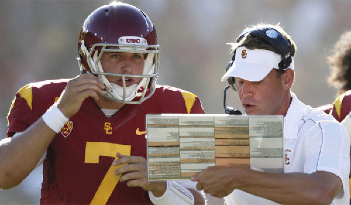 USC Coach Lane Kiffin, right, said he was contacted by the Philadelphia Eagles about Matt Barkley before they drafted the former Trojans quarterback in the fourth round.