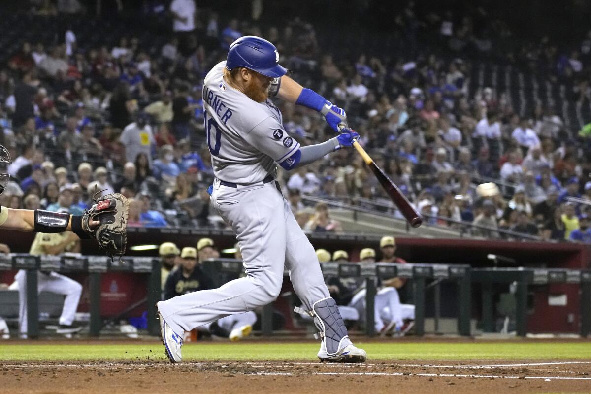 Dodgers third baseman Justin Turner drives in Will Smith (not pictured) on a run-scoring single in the second inning.