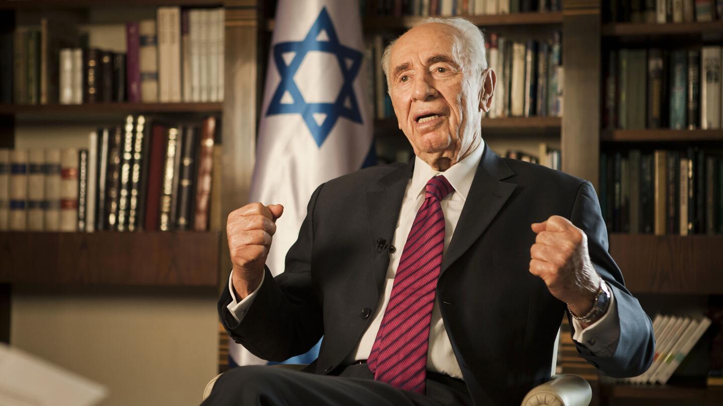 Then-Israeli President Shimon Peres gives an interview at his home in Jerusalem on July 15, 2014.