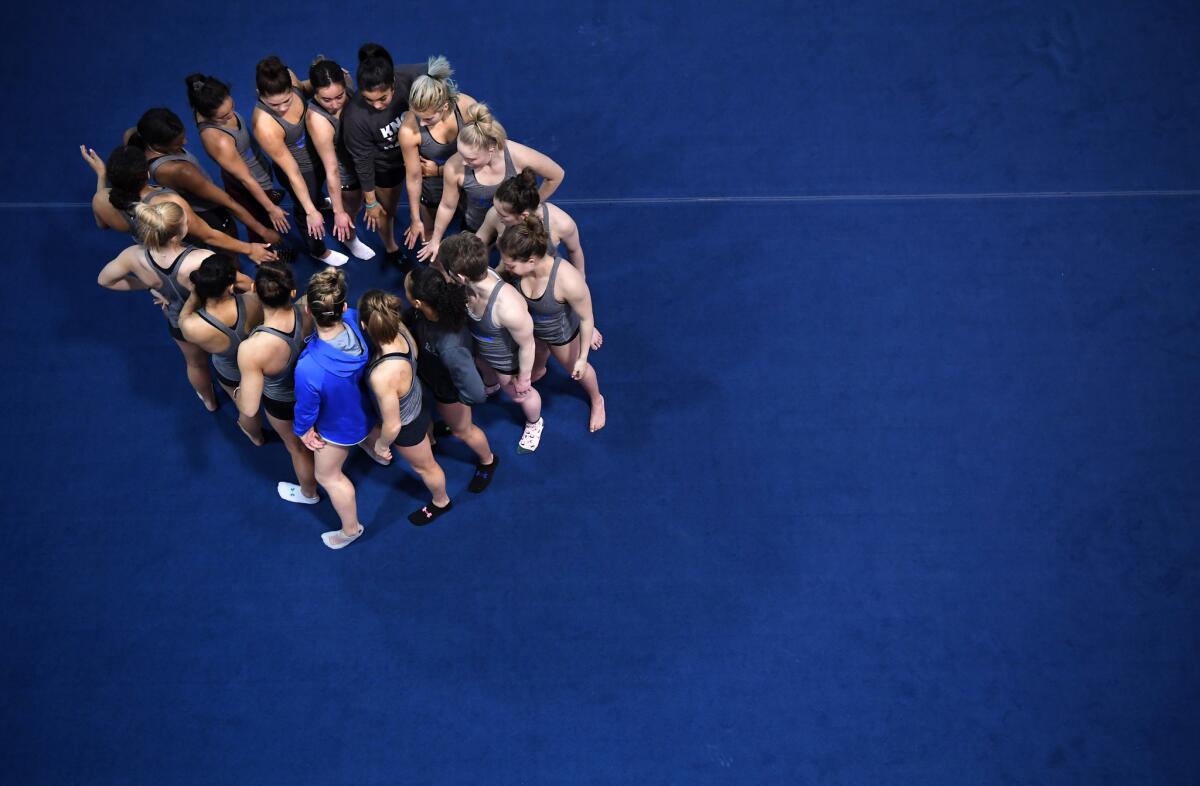 Gymnasts gather before practice at UCLA.