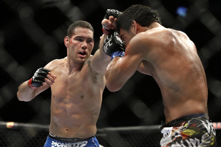 Chris Weidman, left, improved to 12-0 when he defeated Lyoto Machida by unanimous decision in a middleweight title bout July 5.