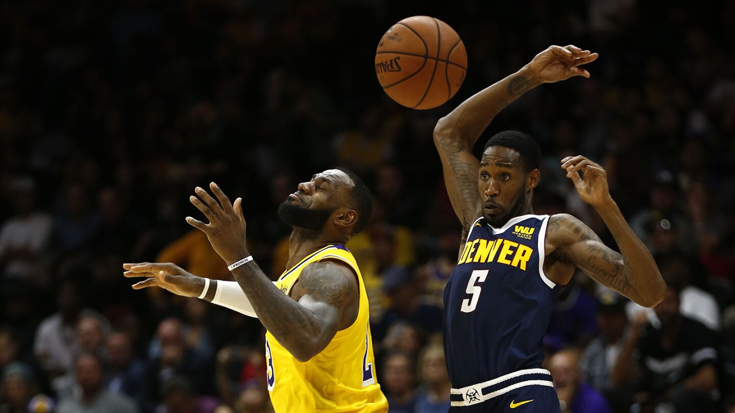 Los Angeles Lakers LeBron James has the ball hit away by Denver Nuggets Will Barton in San Diego on Sunday, September 30, 2018. (Photo by K.C. Alfred/San Diego Union-Tribune)