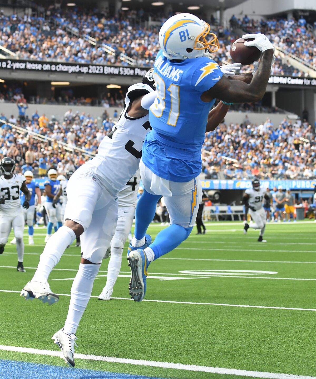 Chargers receiver Mike Williams catches a touchdown pass in front of Jaguars cornerback Tyson Campbell.
