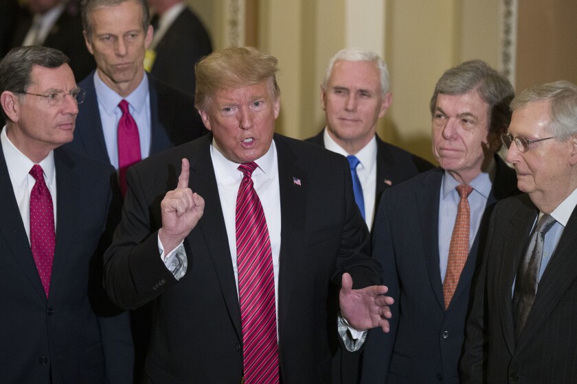 FILE - In this Wednesday, Jan. 9, 2019 file photo, Sen. John Barrasso, R-Wyo., left, and Sen. John Thune, R-S.D., stand with President Donald Trump, Vice President Mike Pence, Sen. Roy Blunt, R-Mo., and Senate Majority Leader Mitch McConnell of Ky., as Trump speaks while departing after a Senate Republican Policy luncheon, on Capitol Hill in Washington. The Republican Party still belongs to Donald Trump. The GOP privately flirted with purging the norm-shattering former president after he incited a deadly riot at the U.S. Capitol last month. But in the end, only seven of 50 Senate Republicans voted to convict Trump in his historic second impeachment trial on Saturday, Feb. 13, 2021. (AP Photo/Alex Brandon, File)