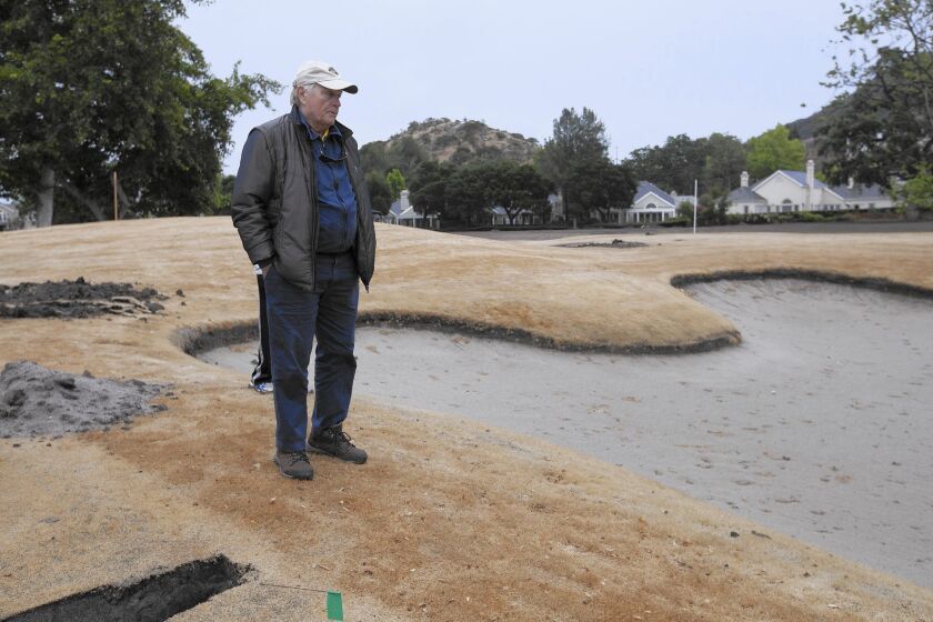 Golf legend and course designer Jack Nicklaus surveys a sand trap at Sherwood Country Club under renovation in Thousand Oaks.