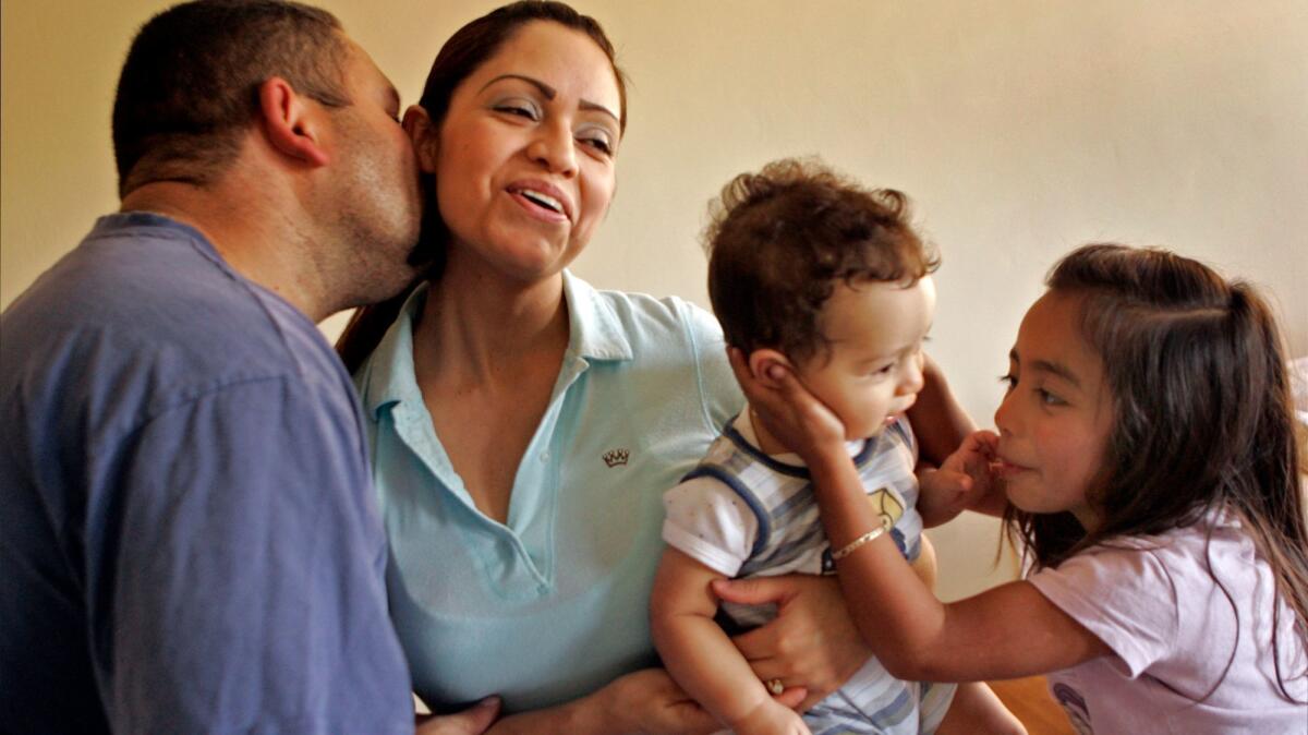 Liliana Sanchez de Saldivar during a 2007 visit from her husband Gerardo and children, including Gerardo Jr. and daughter Susy, while she lived at the United Church of Christ in Simi Valley while avoiding deportation. (Lawrence K. Ho / Los Angeles Times)