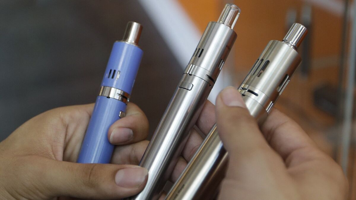 Health officials say they want more federal action on Big Tobacco and the e-cigarette industry. Above, e-cigarettes for sale at a Sacramento store.