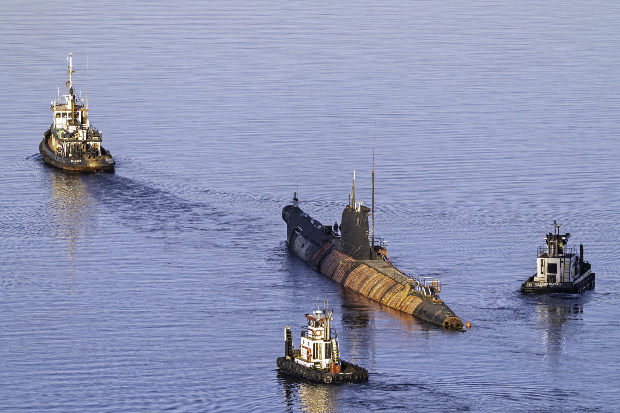 The Soviet submarine B-39 was towed out of San Diego Sunday.
