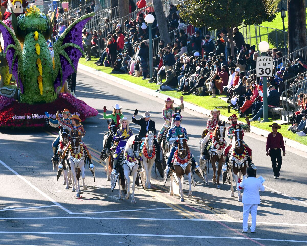 Riders from the Scripps Miramar Saddlebreds take part in the parade.