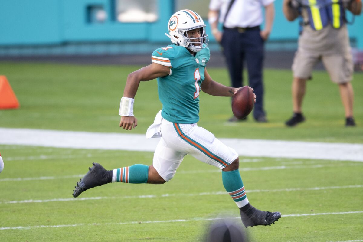 Miami Dolphins quarterback Tua Tagovailoa scrambles against the Kansas City Chiefs on Sunday.