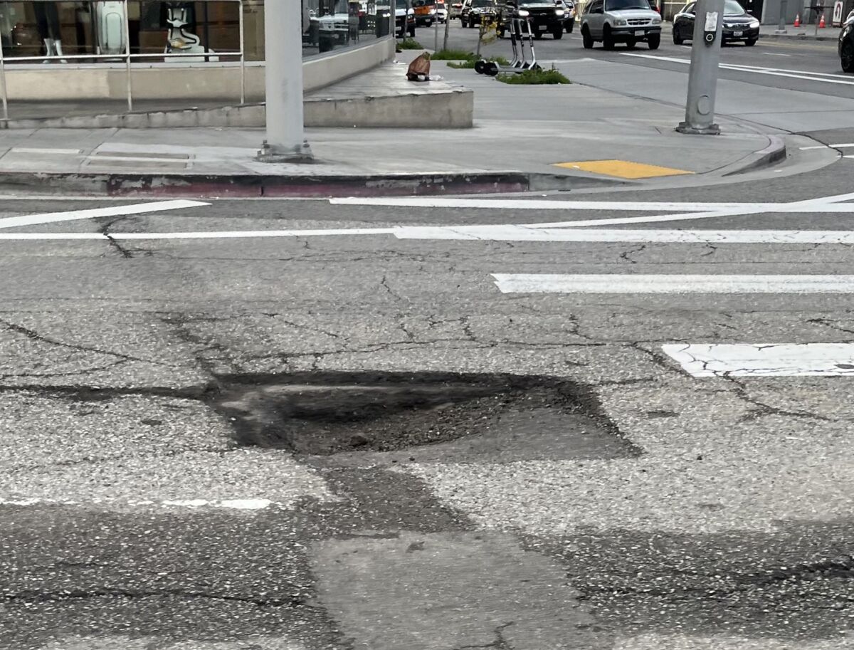 A square-shaped pothole