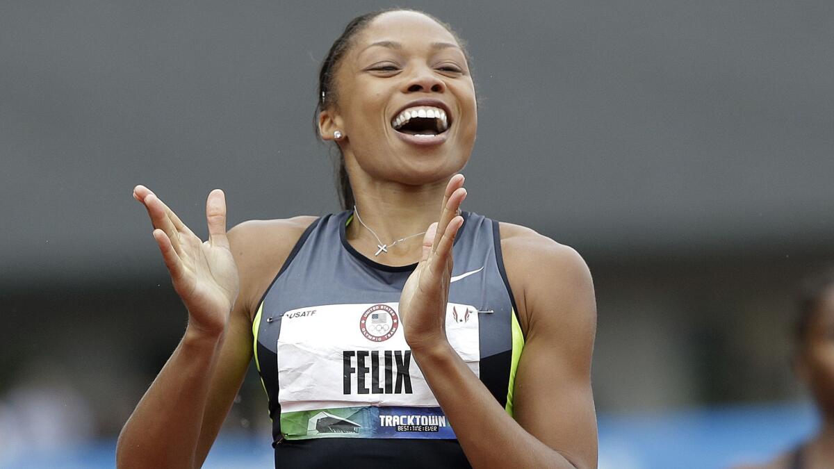 Allyson Felix celebrates after winning the women's 200 meters at the U.S. Olympic Track and Field Trials in Eugene, Ore., in June 2012.