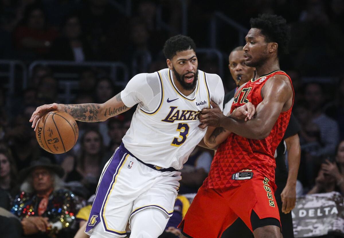 Lakers forward Anthony Davis was double-teamed throughout Sunday's 122-101 victory over the Atlanta Hawks at Staples Center.