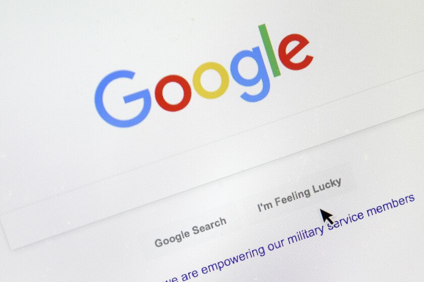 FILE - A cursor moves over Google's search engine page on Aug. 28, 2018, in Portland, Ore. The company built on quickly finding answers to people's questions suddenly finds itself grappling for a response to a form of artificial intelligence that long-time rival Microsoft is now deploying to attack its dominant search engine. Microsoft's assault combined with concerns Google's ability to ward it off contributed to a nearly 8% decline in the stock price of Google's corporate parent Wednesday, Feb. 8, 2023, in a selloff that wiped out more than $100 billion in shareholder wealth. (AP Photo/Don Ryan, File)
