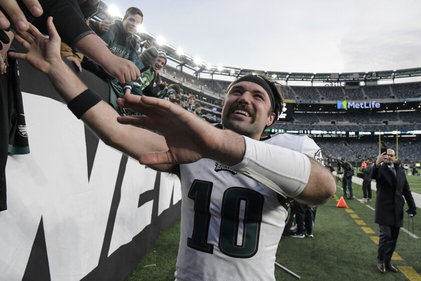 Philadelphia Eagles quarterback Gardner Minshew celebrates with fans after an NFL football game against the New York Jets, Sunday, Dec. 5, 2021, in East Rutherford, N.J. (AP Photo/Bill Kostroun)