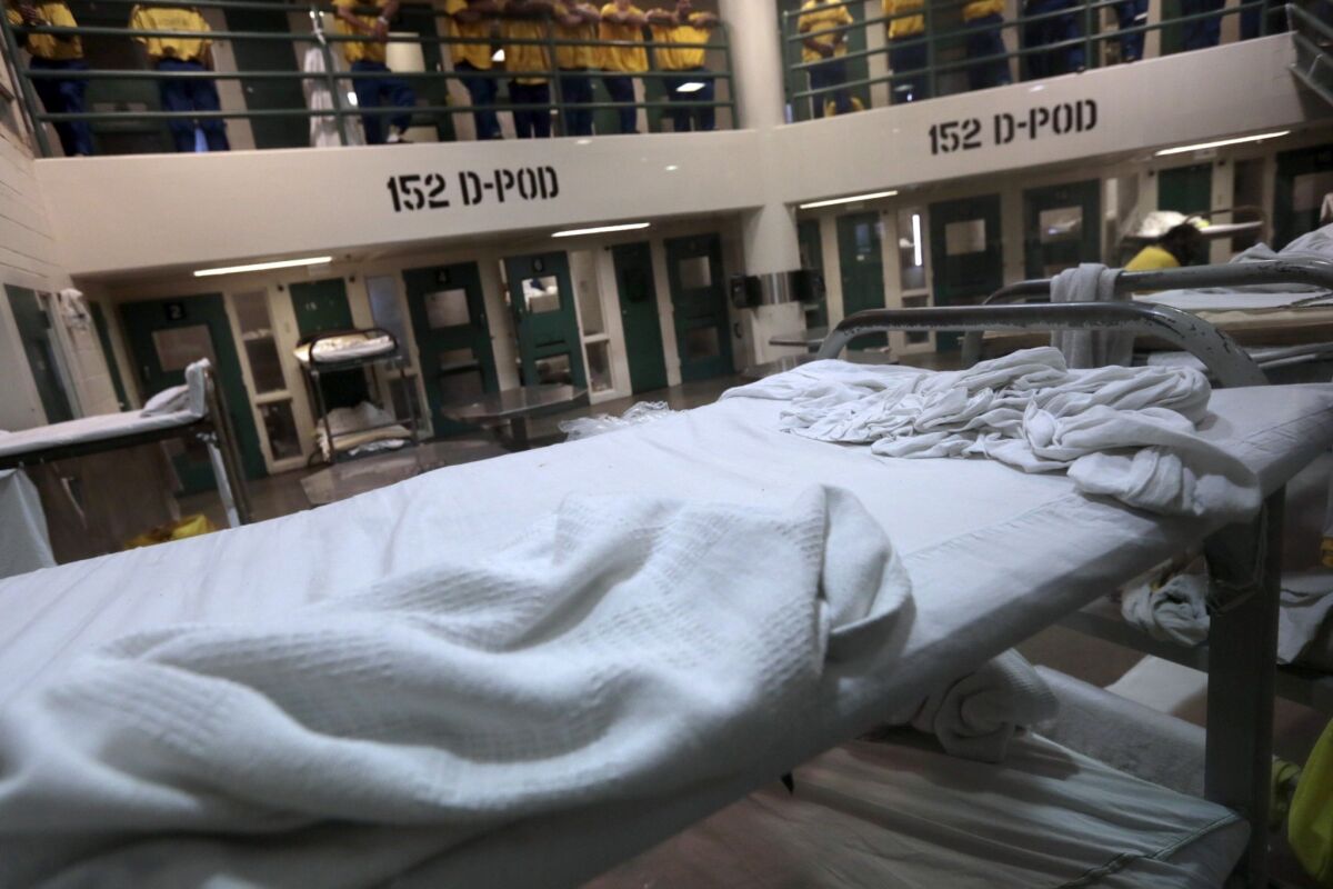 Bunk beds are spread throughout a common area at the Twin Towers Correctional Facility.